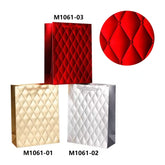 Colorful collection of Gift Bag PT(26*32*10M/M1061M) in red, gold, and silver with diamond quilted design.